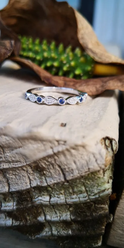 14K White gold Sapphire and diamond milgrain band.