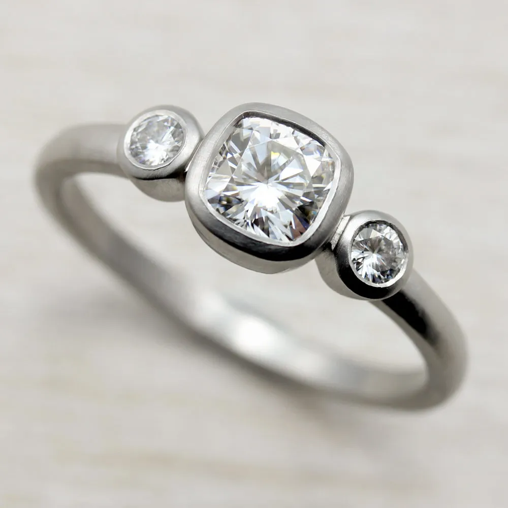 Bezel-set Cushion Three Stone Ring •